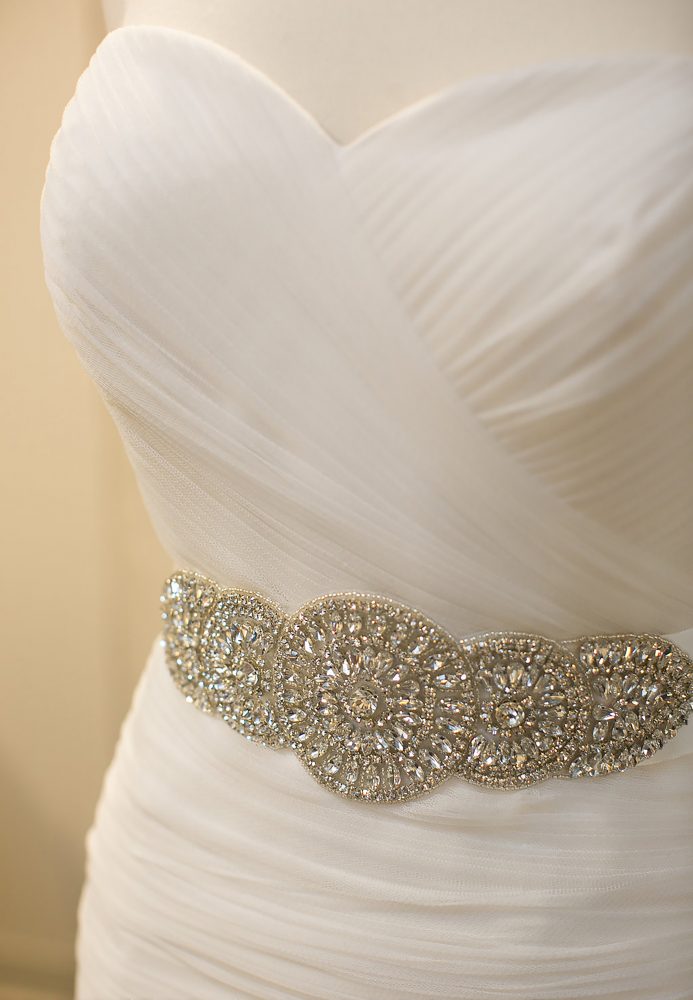 detail image of beautiful gown showcasing jeweled waste