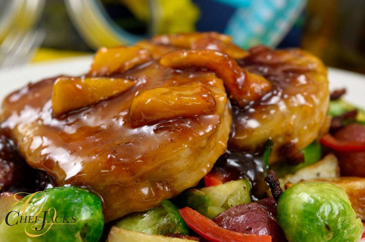 Glazed pork chops over a bed of brussel sprouts by Chef Jack's Catering
