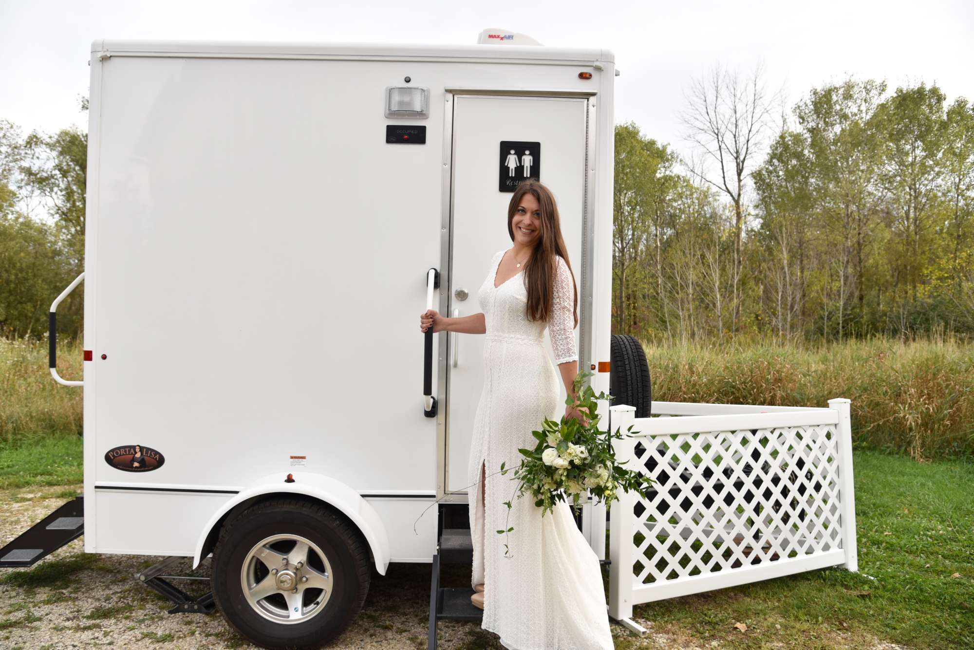 Bride entering upscale portable restrooms