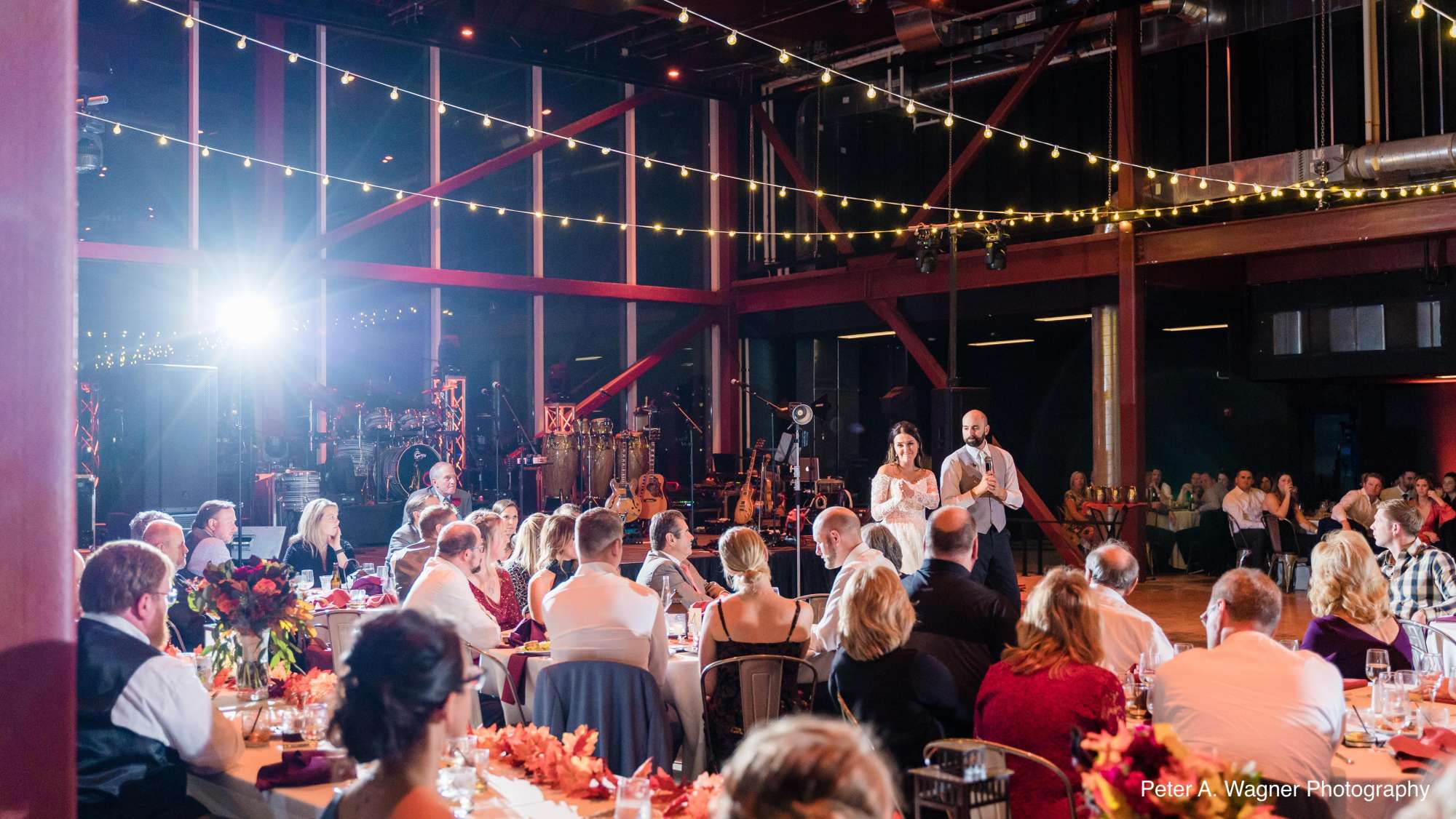 Claire and Nick share a joyful moment during their wedding celebration at Jan Serr Studio.