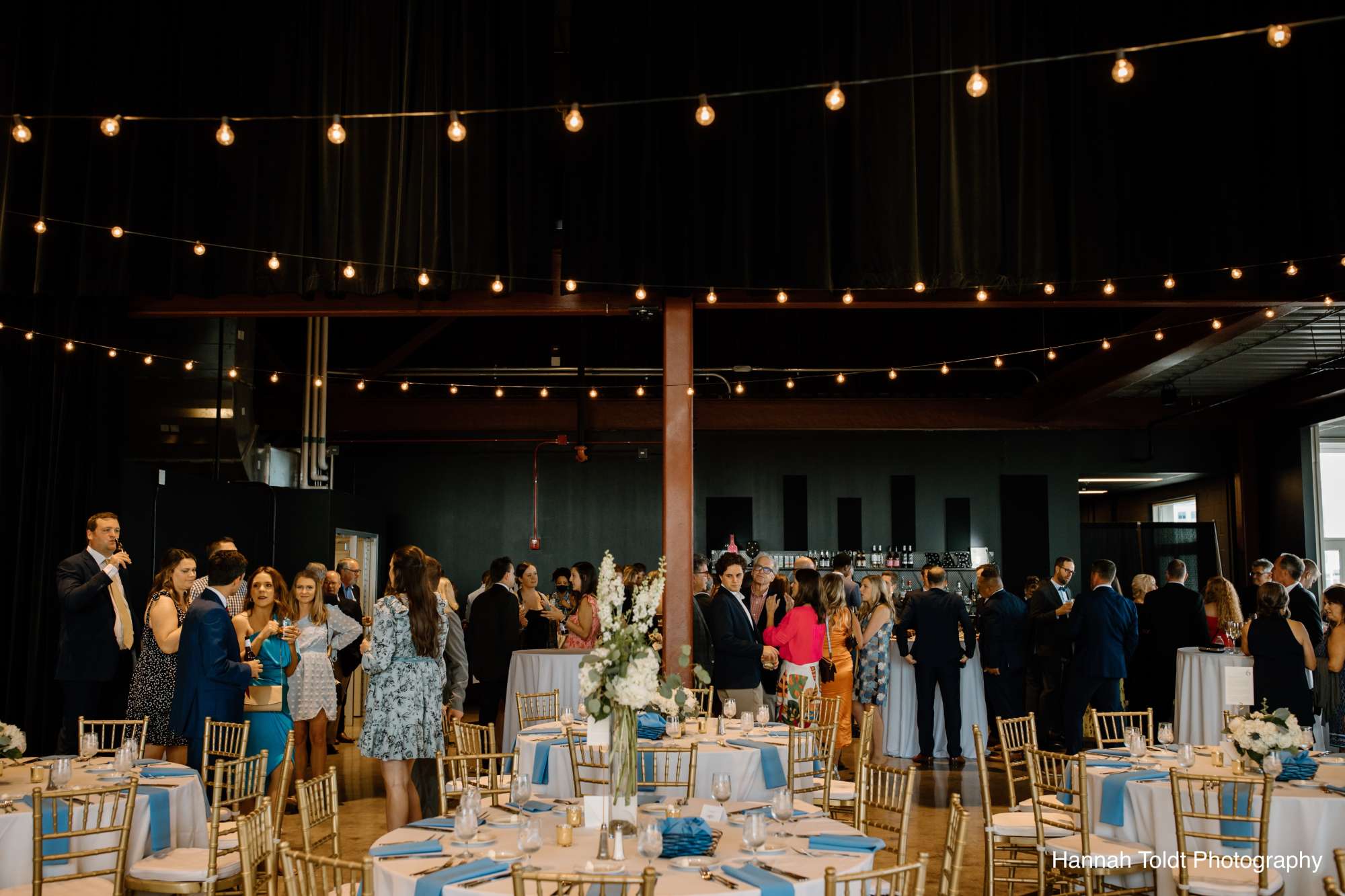 Guests mingle during cocktail hour in the open and inviting ambiance of Jan Serr Studio.