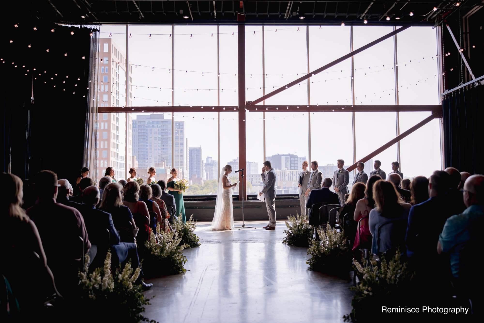Brian and Emma exchange vows in the modern and sunlit setting of Jan Serr Studio.