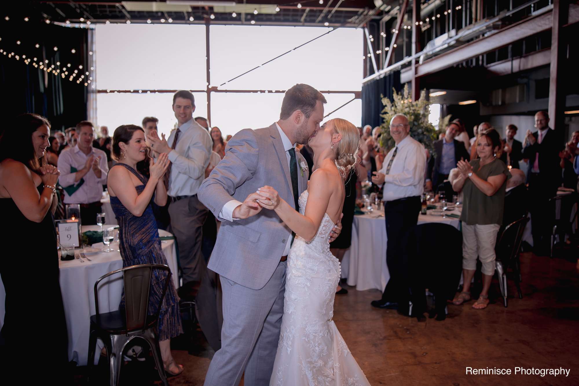 Brian and Emma share their first dance in the ambient evening light of Jan Serr Studio.