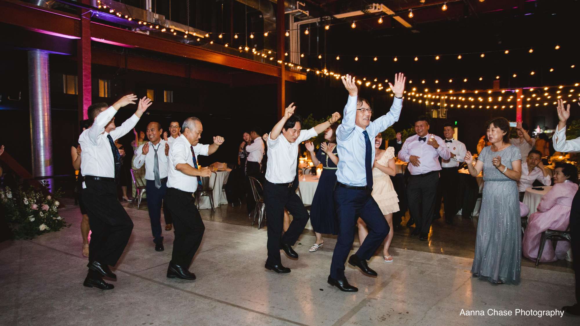 Wedding guests enjoy a lively dance party on the spacious floor of Jan Serr Studio.