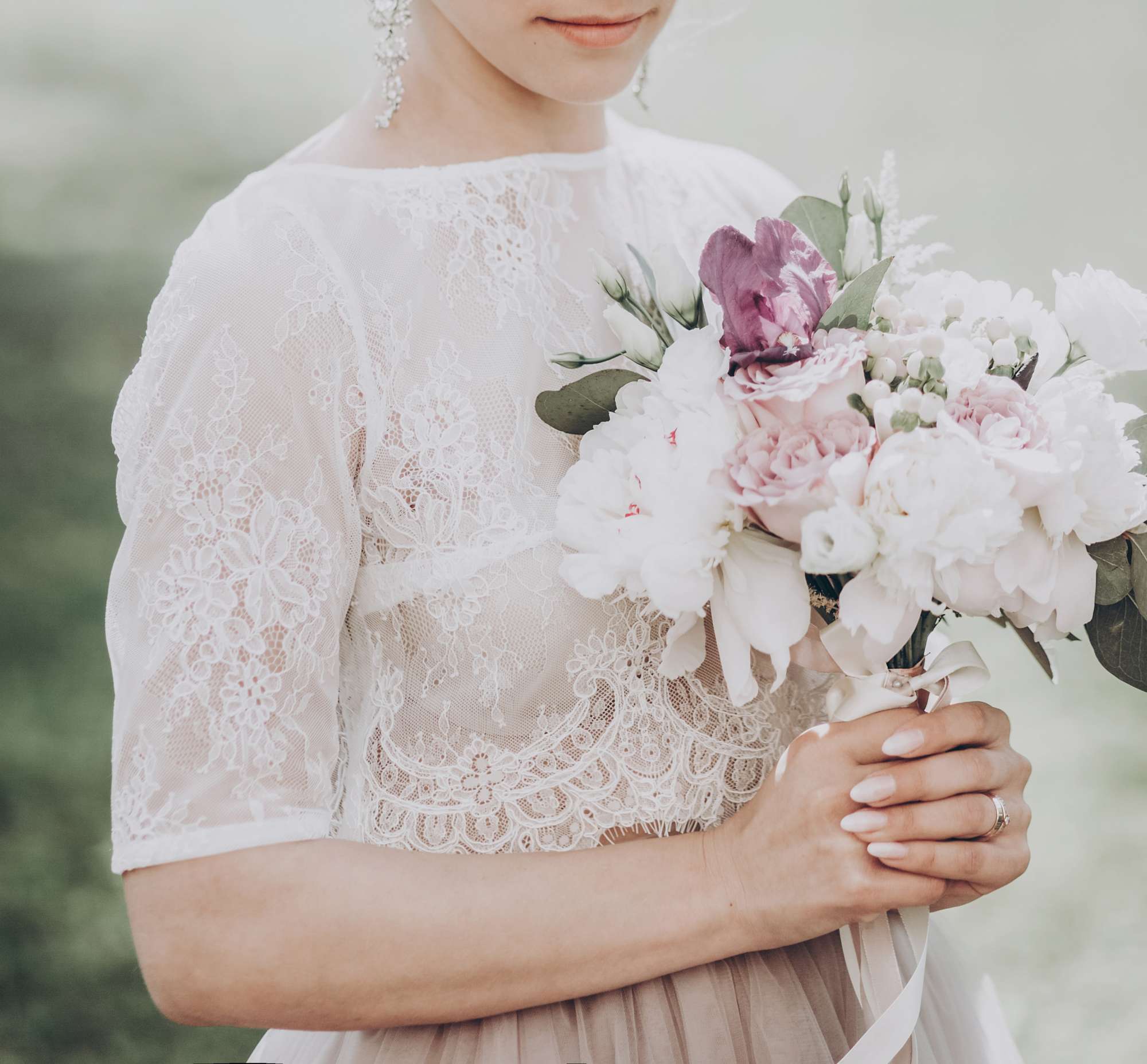 Bridal holding flowers - Martinizing Gown preservation