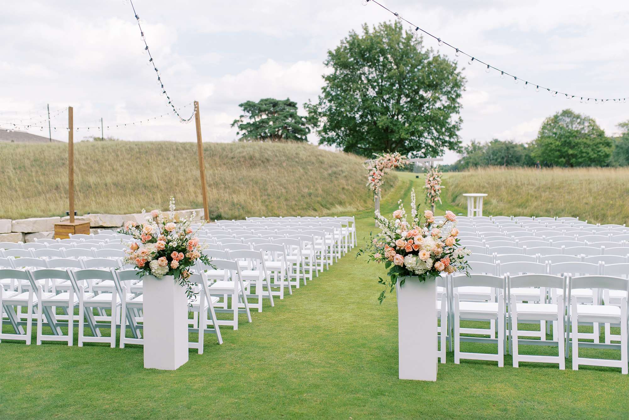 Outdoor wedding ceremony set up at the Carriage House at Lac La Belle.