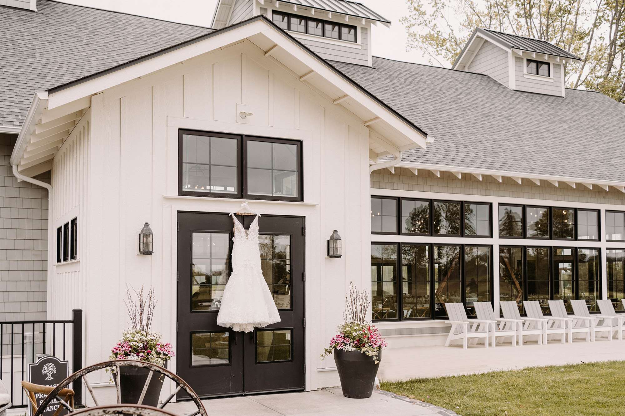 Wedding dress hung on door at The Carriage House at the Club at Lac La Belle.