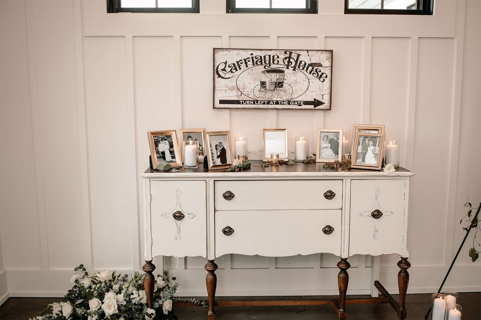 The Carriage House at the Club at Lac La Belle's entry area with table dressed for wedding reception.