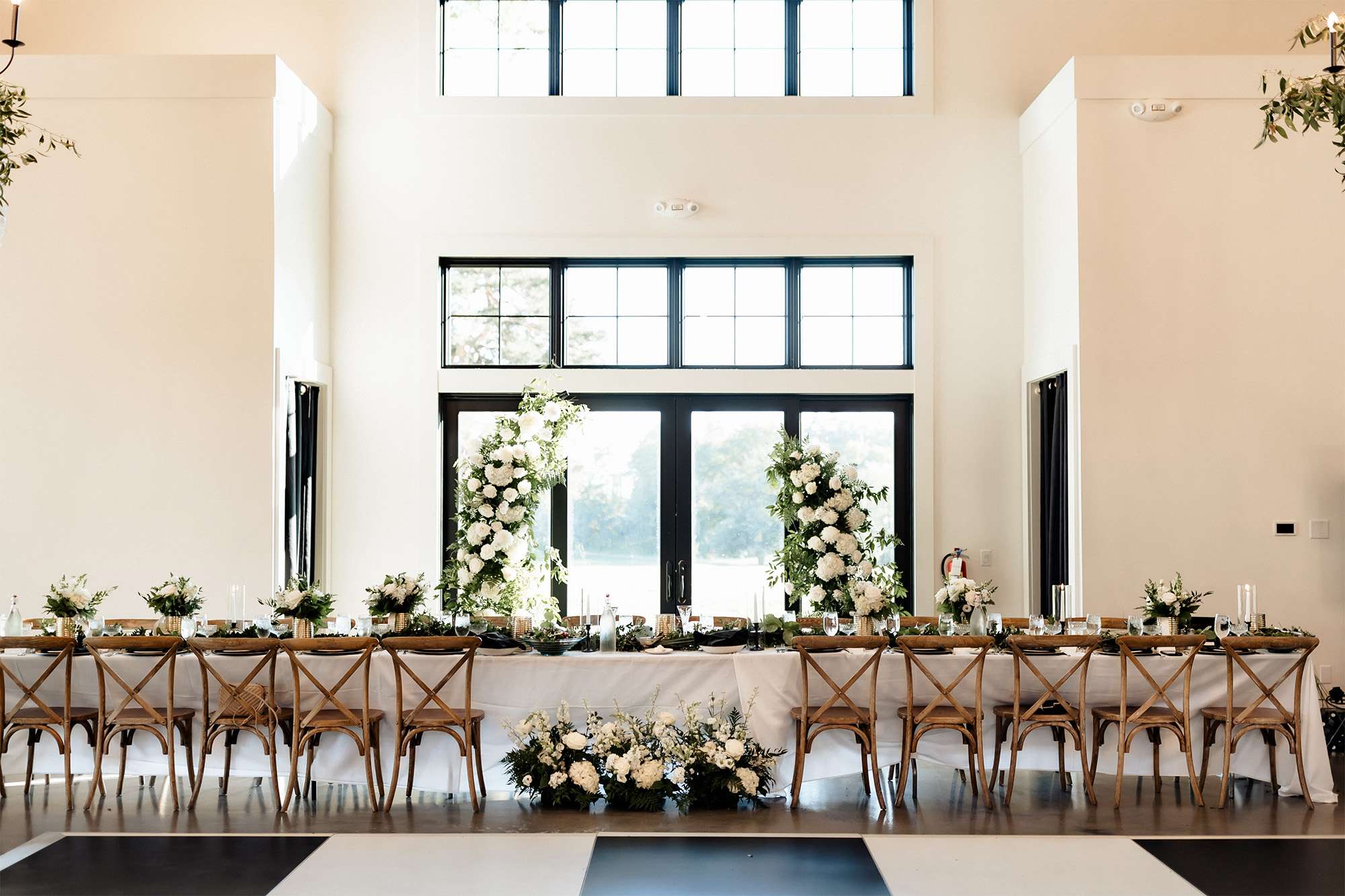 Elegant head table at The Carriage House at the Club at Lac La Belle