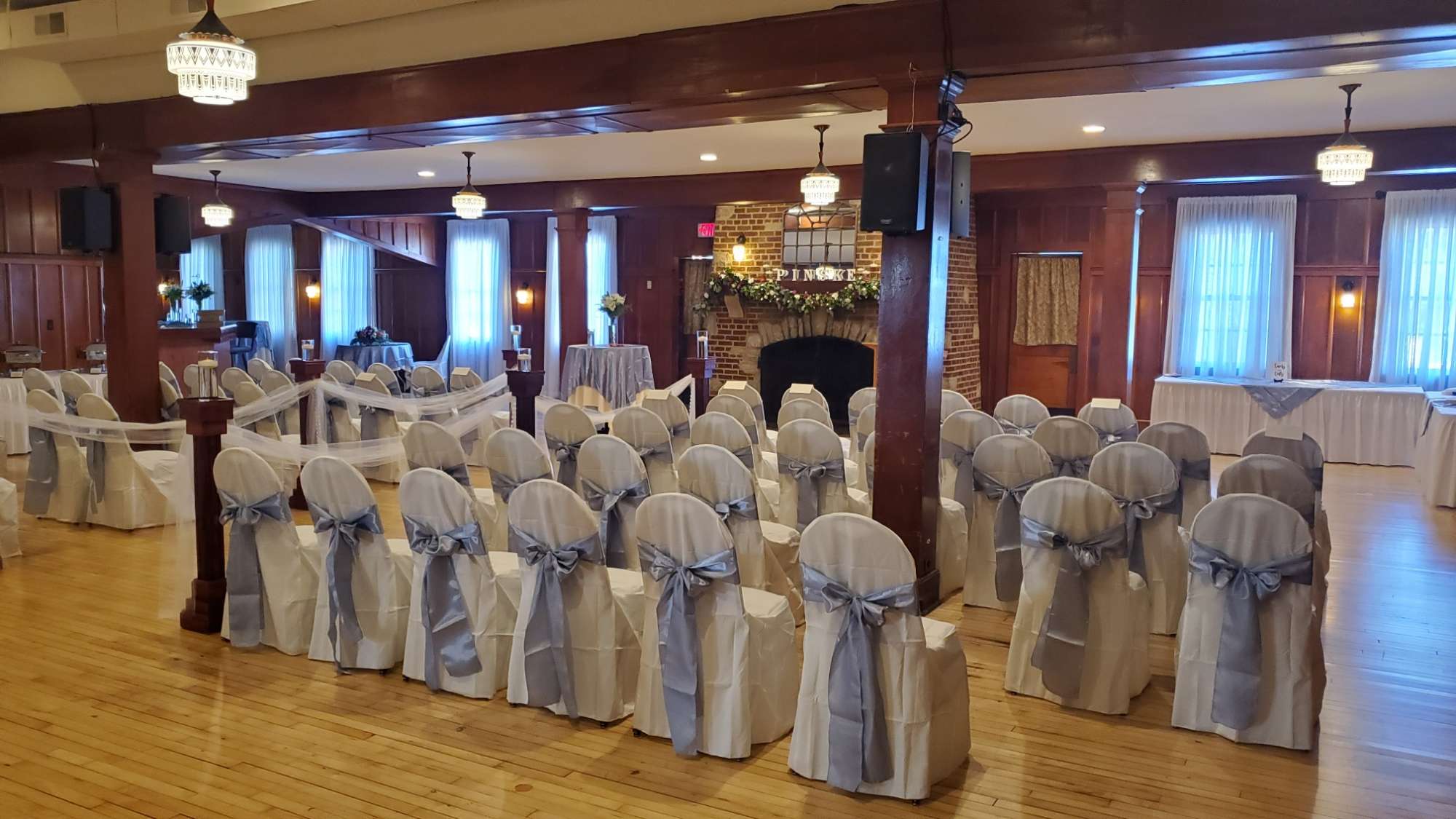 Wedding ceremony by the fireplace at the Chandelier Ballroom in Hartford, WI.