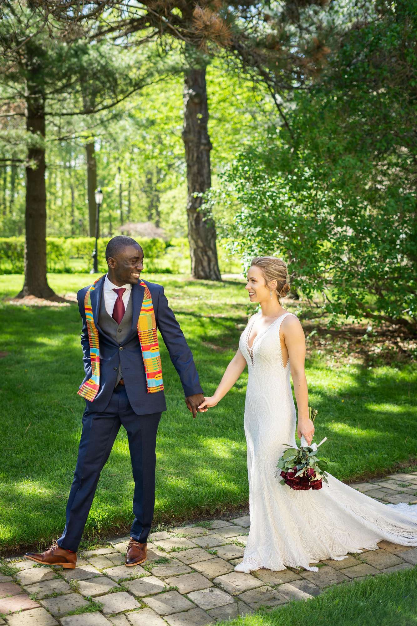 Bride and groom walk hand in hand at the Dekoven Center in Racine, WI