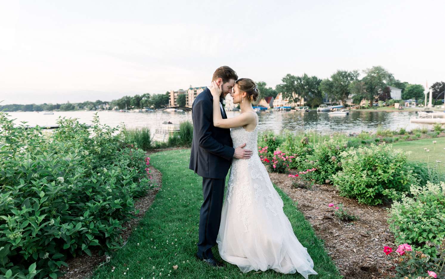 Bride and groom embrace outside of the Oconomowoc Community Center