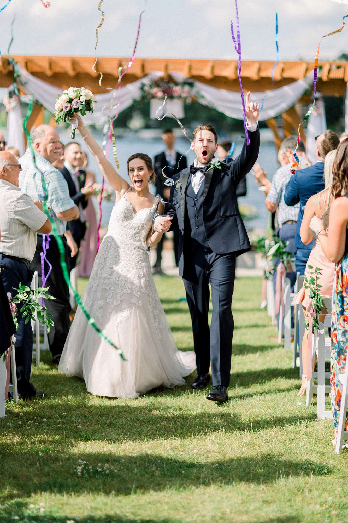 Newlyweds come back up the aisle at their Oconomowoc Community Center wedding.