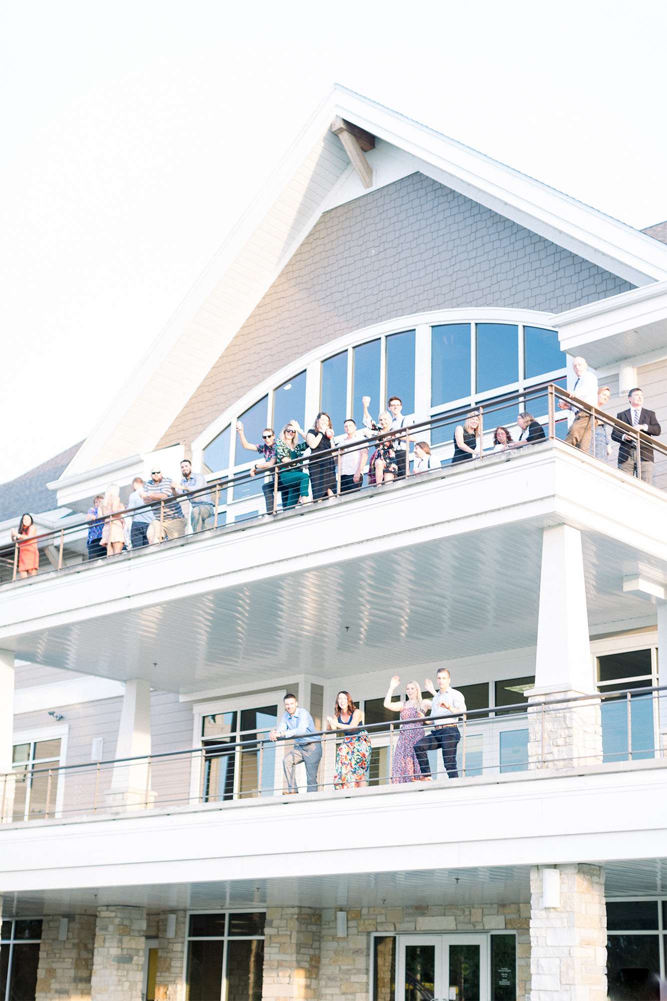 Wedding guests enjoy the beautiful views and fresh air at a Oconomowoc Community Center wedding.