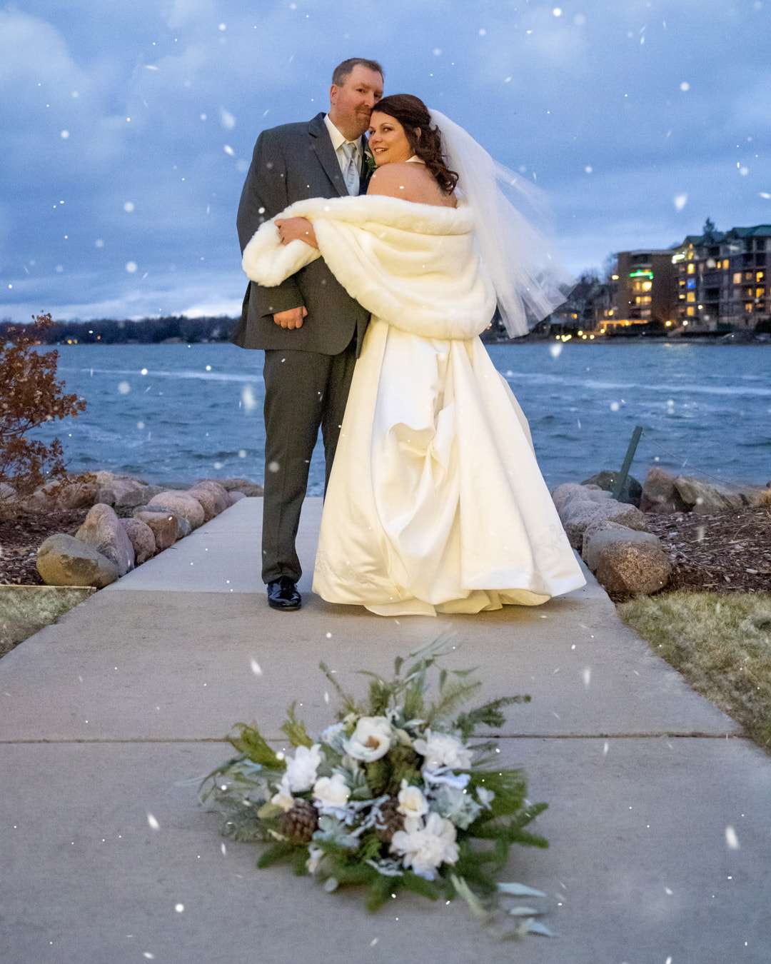 Bride and groom pose outside The Oconomowoc Community Center