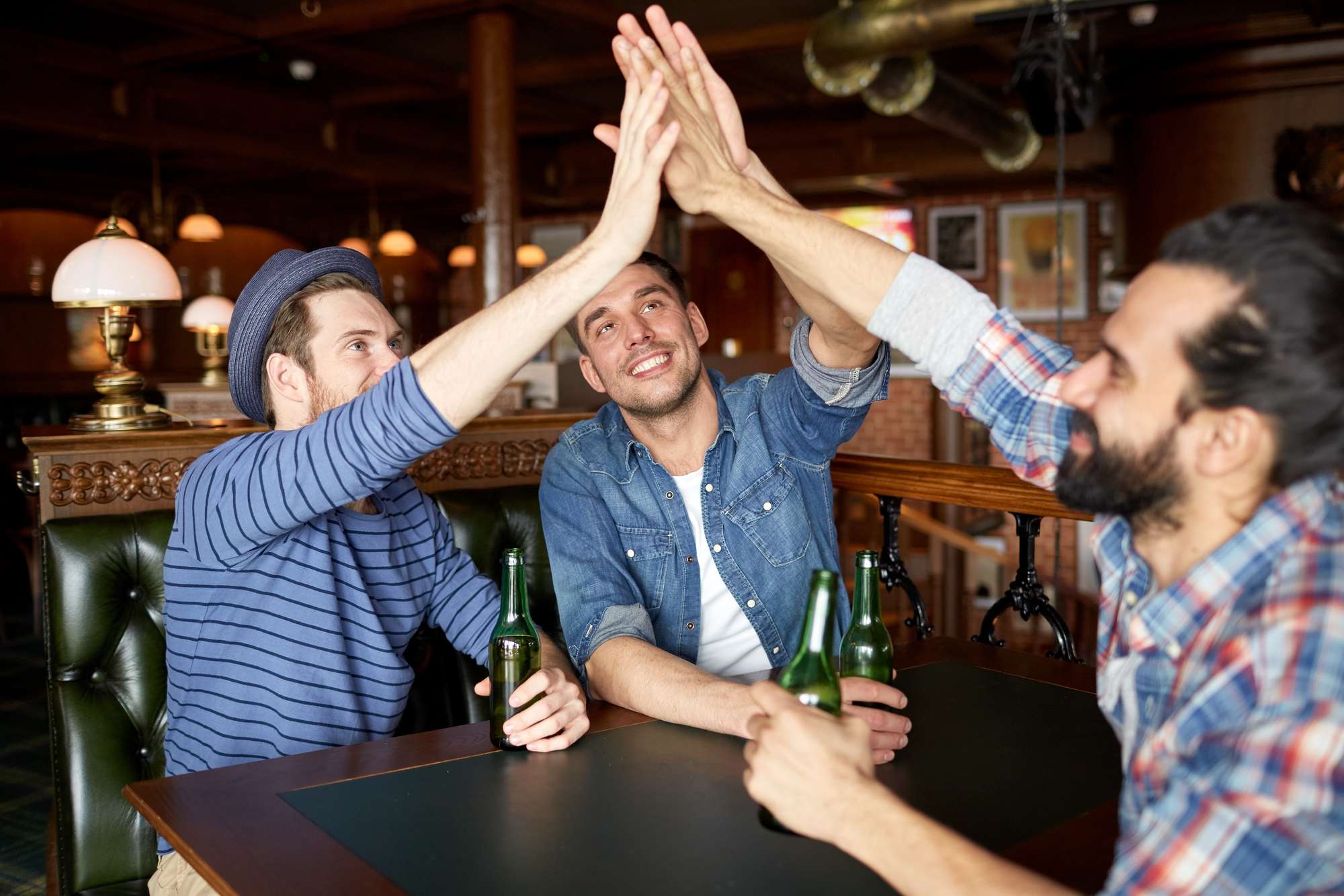 guys high five at bachelor party