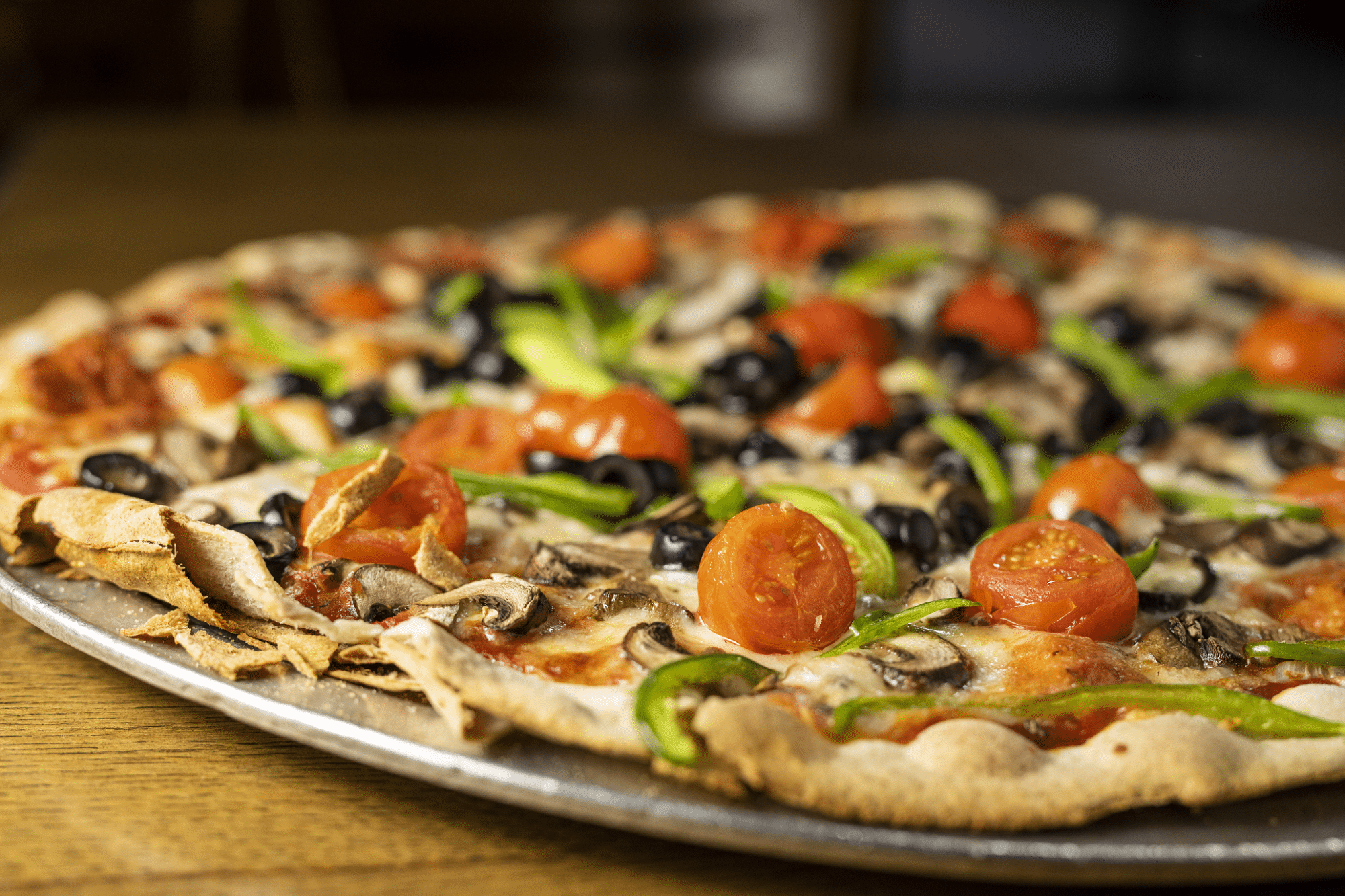 Veggie supreme pizza is one of many popular pizzas crafted by Pizza Man – Wauwatosa Veggie supreme pizza is one of many popular pizzas crafted by Pizza Man - Wauwatosa