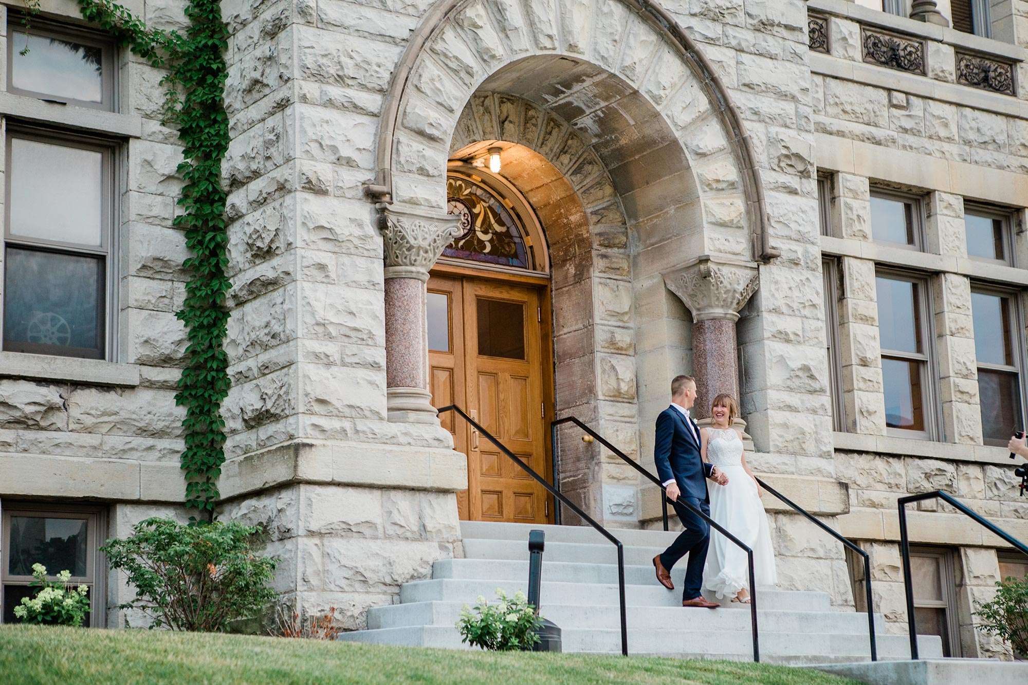 Haylie and Andy walk down steps at Historic Courthouse 1893