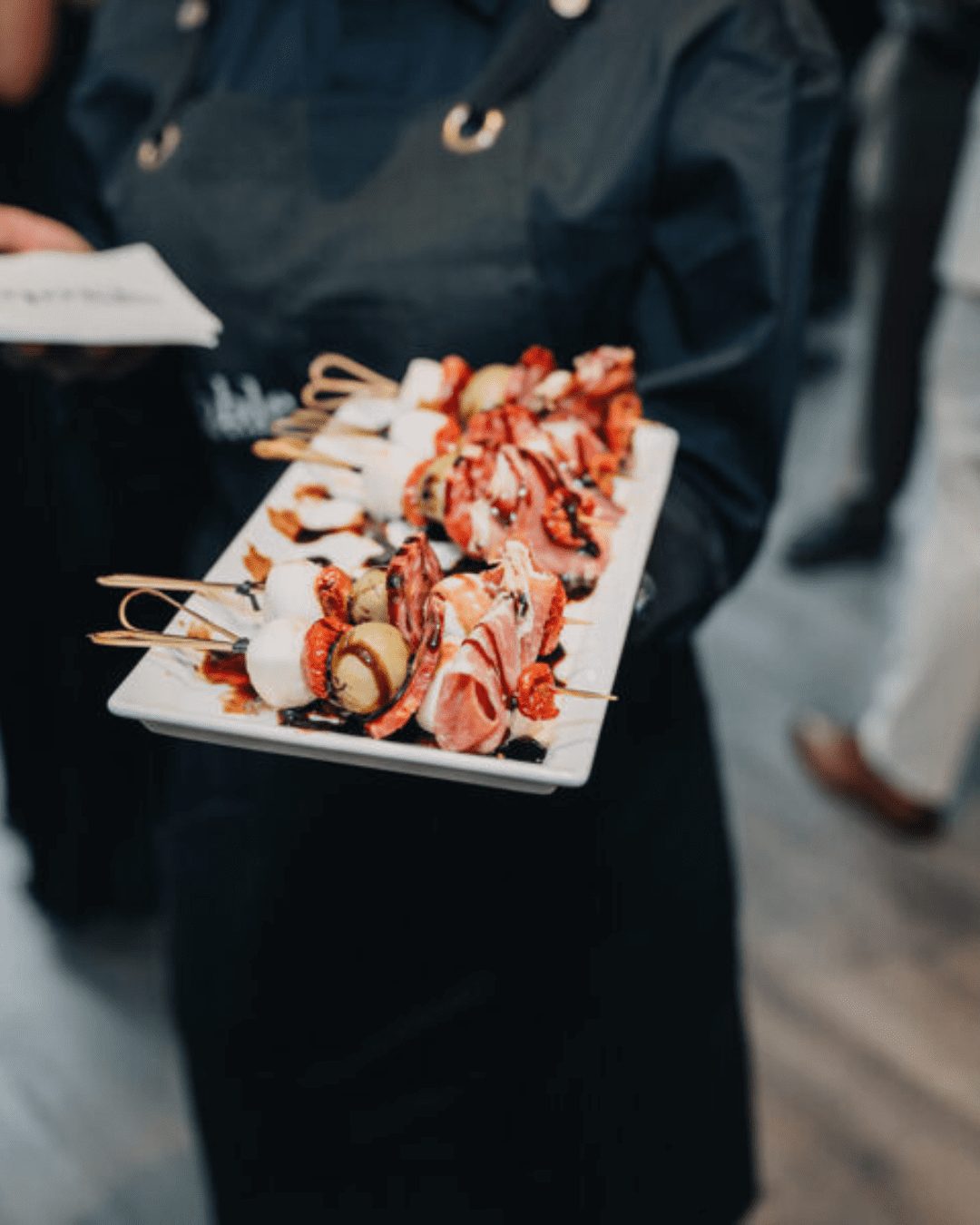 An elegant tray of skewered gourmet bites served by Noble Catering, perfect for upscale events and cocktail hours.