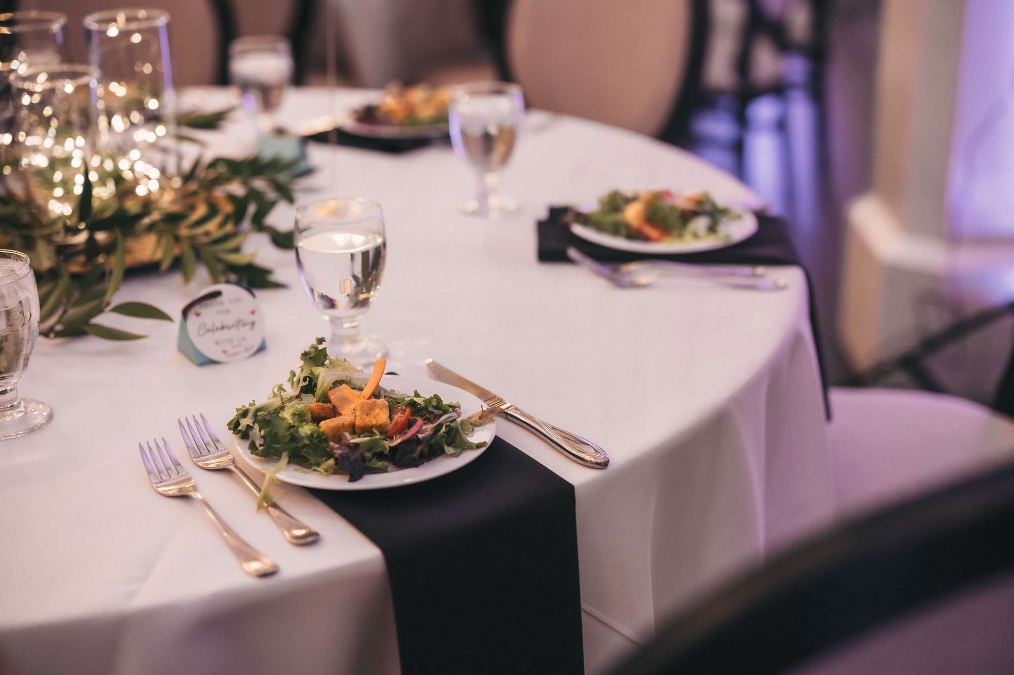 noble catering and events starter salad with color on black linen napkin