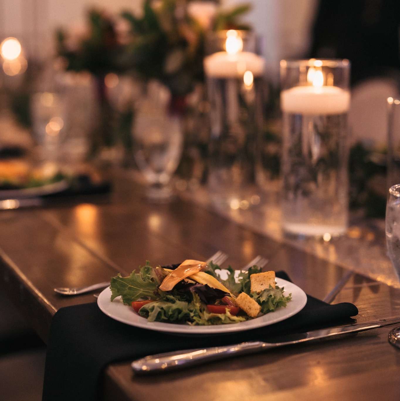 salad starter and romantic place setting by noble catering and events