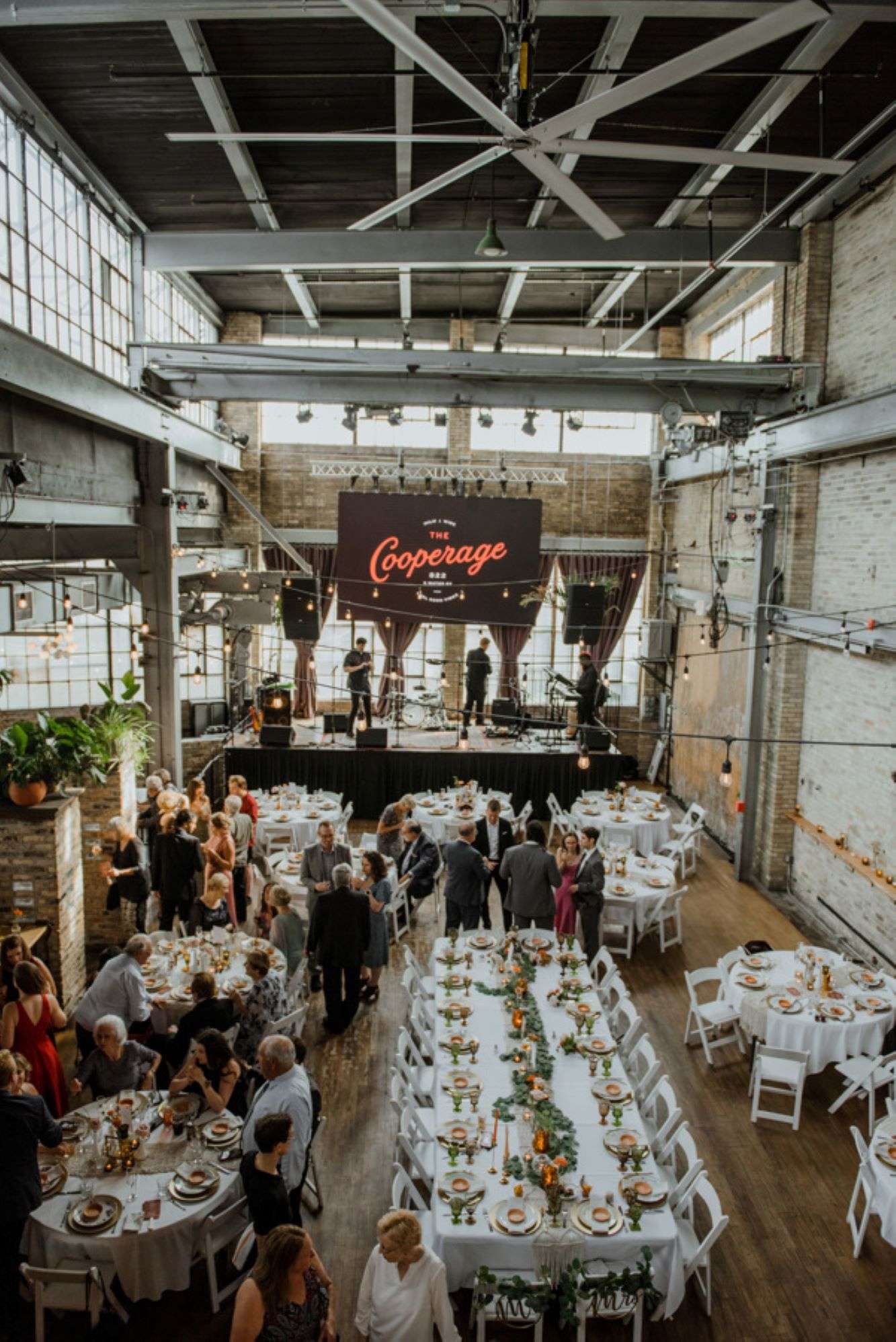 Wedding receptions at the Cooperage brings music venue vibes to beautiful table settings.
