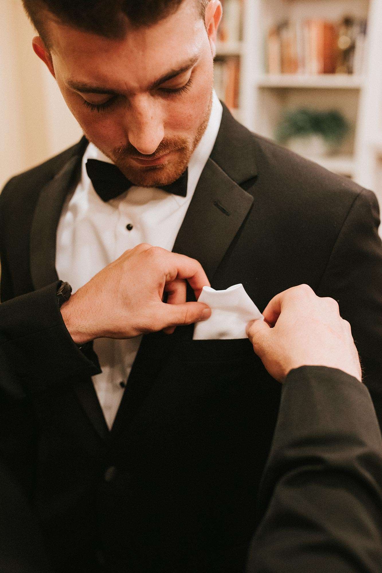 Sam gets assistance with pocket square in his suit from Dubois Formalwear Sam gets assistance with pocket square in his suit from Dubois Formalwear