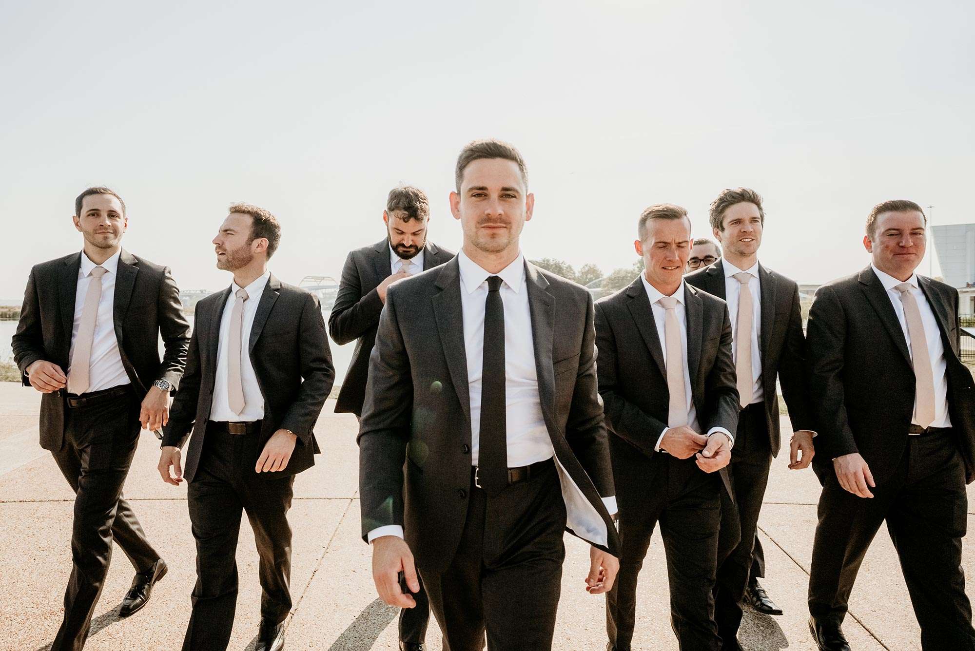 Brandon leads his groomsmen in their suits from NL Suits Brandon leads his groomsmen in their suits from NL Suits