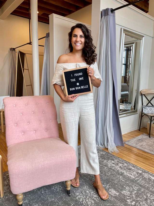 Bride holding sign that says