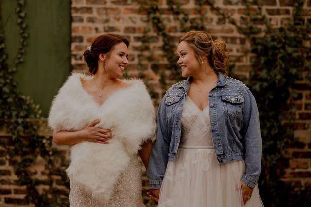 Brides smile at each other- Bon Bon Belle Bridal