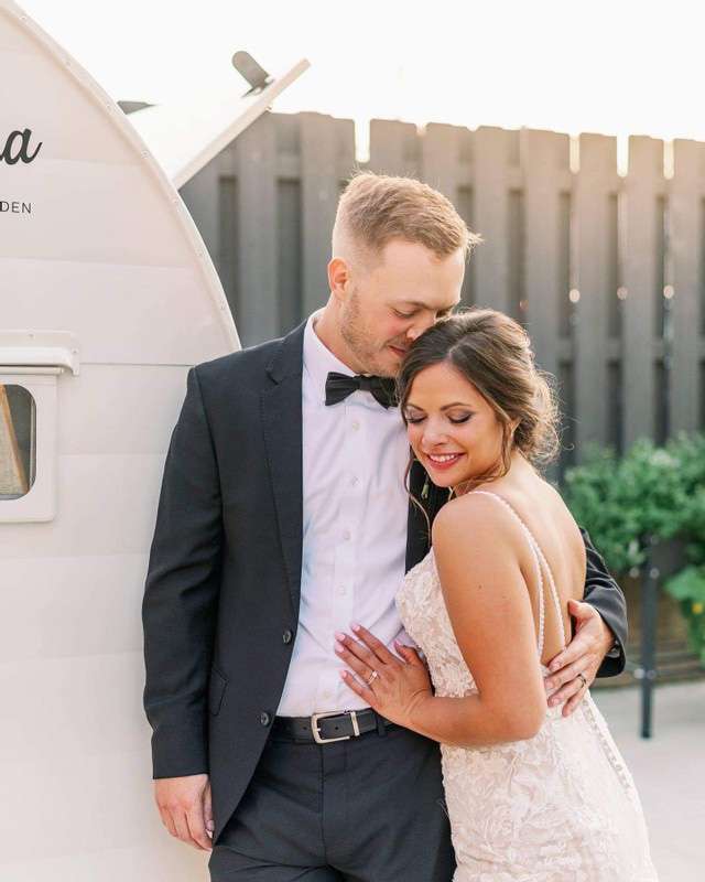 Bride, wearing a gown from Bon Bon Belle Bridal, and groom,