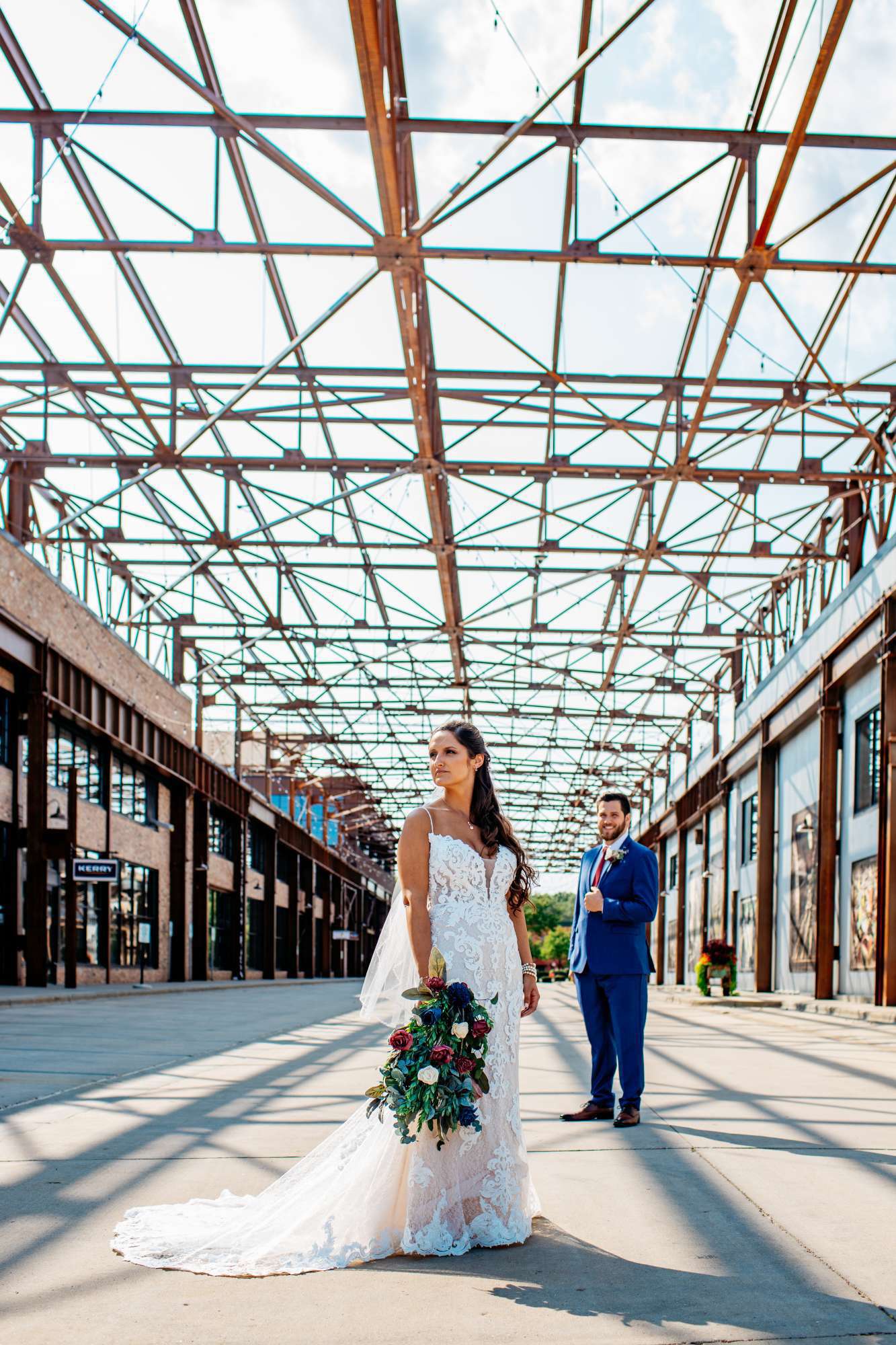 Bride and groom pose outside the Ironworks Hotel Beloit