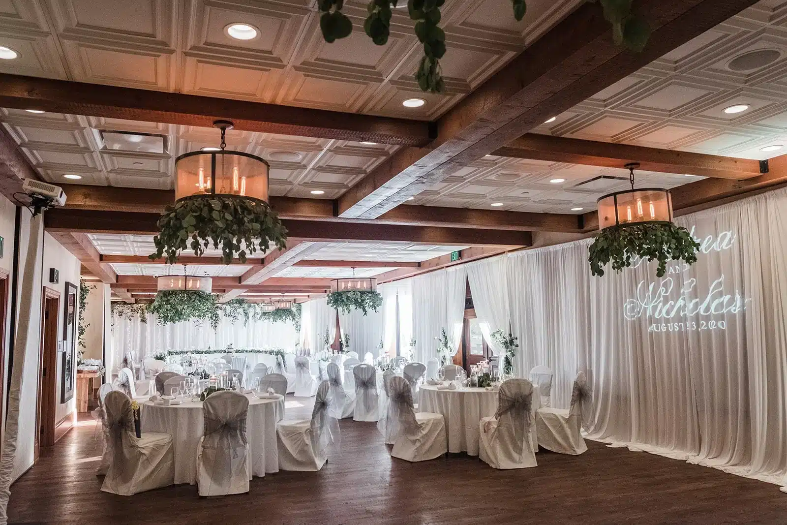Indoor wedding reception area at Ironworks Hotel with detailed ceilings and modern decor.