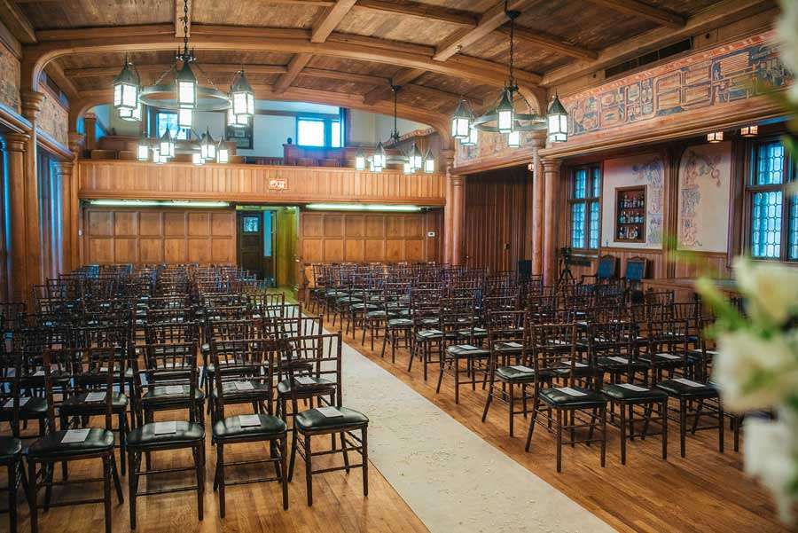 The Great Hall at Best Place at Historic Pabst Brewery: A spacious event area featuring original stained glass windows, ornate woodwork, and historic charm.
