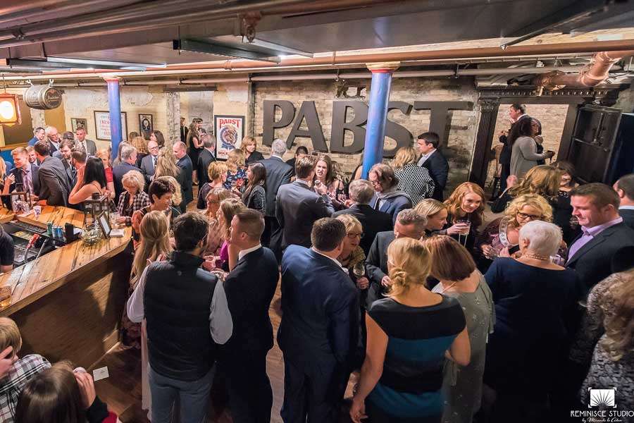 Guests enjoying an intimate wedding reception in the iconic Speakeasy setting at Best Place at Historic Pabst Brewery.