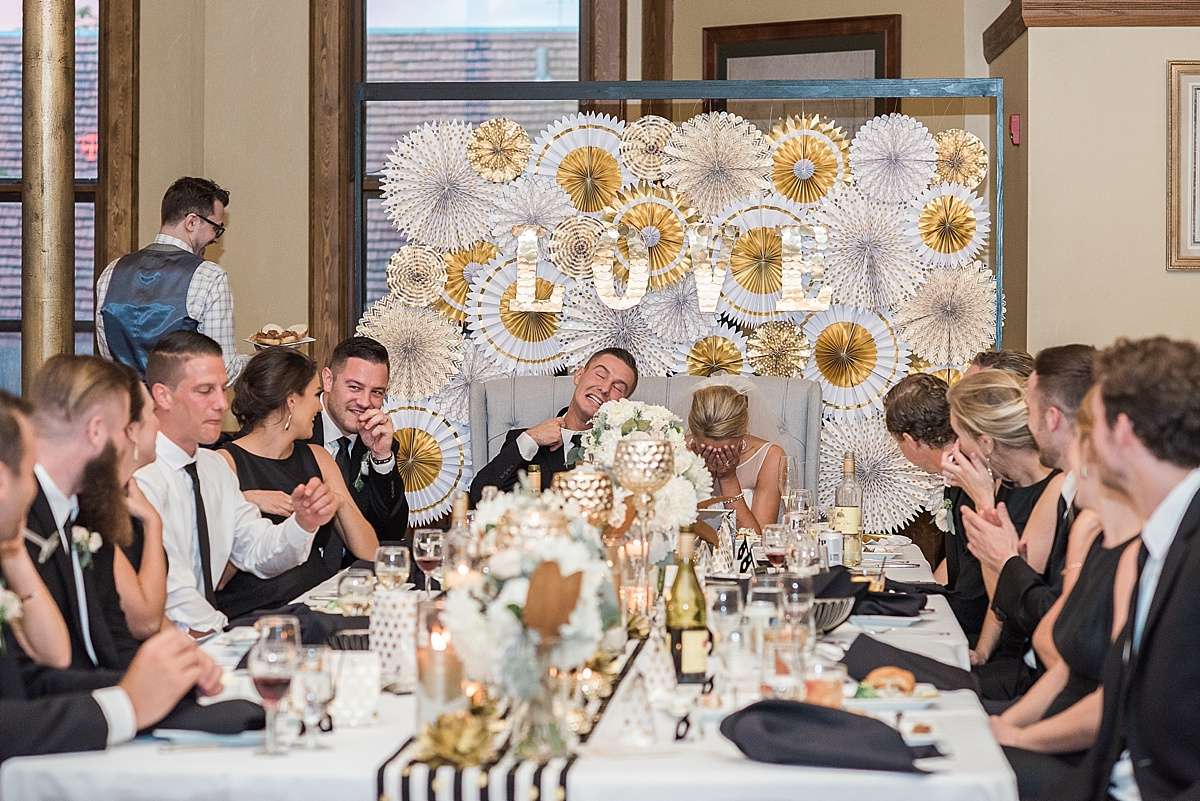 A beautifully decorated head table radiates joy and elegance in The Great Hall at Best Place at Historic Pabst Brewery.
