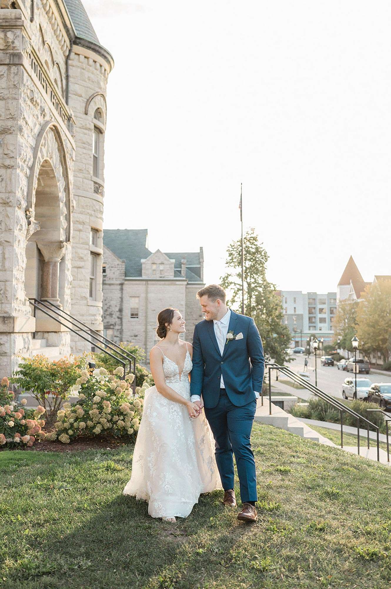 Couple gazing at each other on outside lawn of Historic Courthouse 1893a