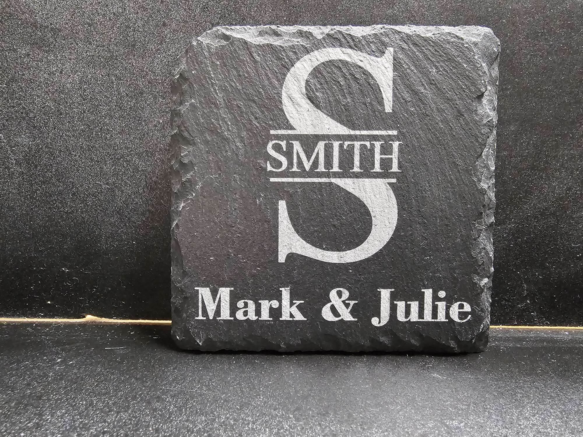 Black coaster customized with an engraved monogram for the perfect wedding gift by Lazering Memories