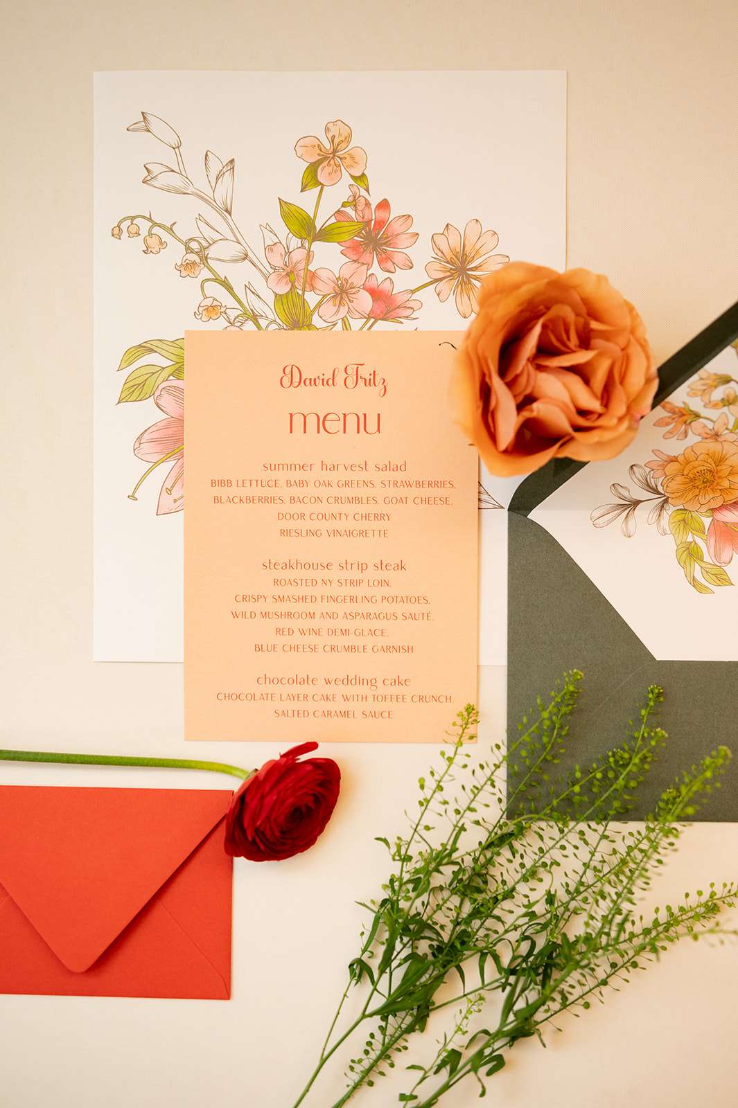 Wildflower wedding invitations, showing off food menu in red greens and orange colors. Wildflower wedding invitations, showing off food menu in red greens and orange colors.