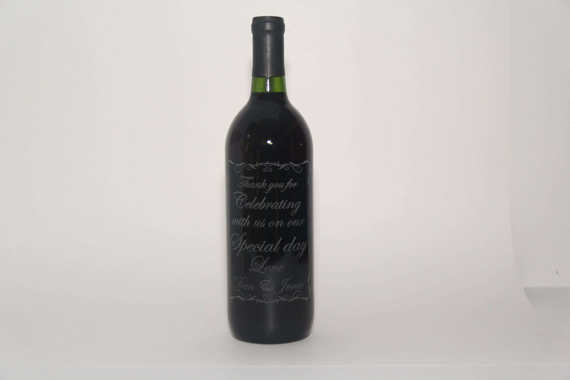 Etched wine bottle by Lazering Memories for a perfect wedding gift, wedding favor, or table centerpiece.