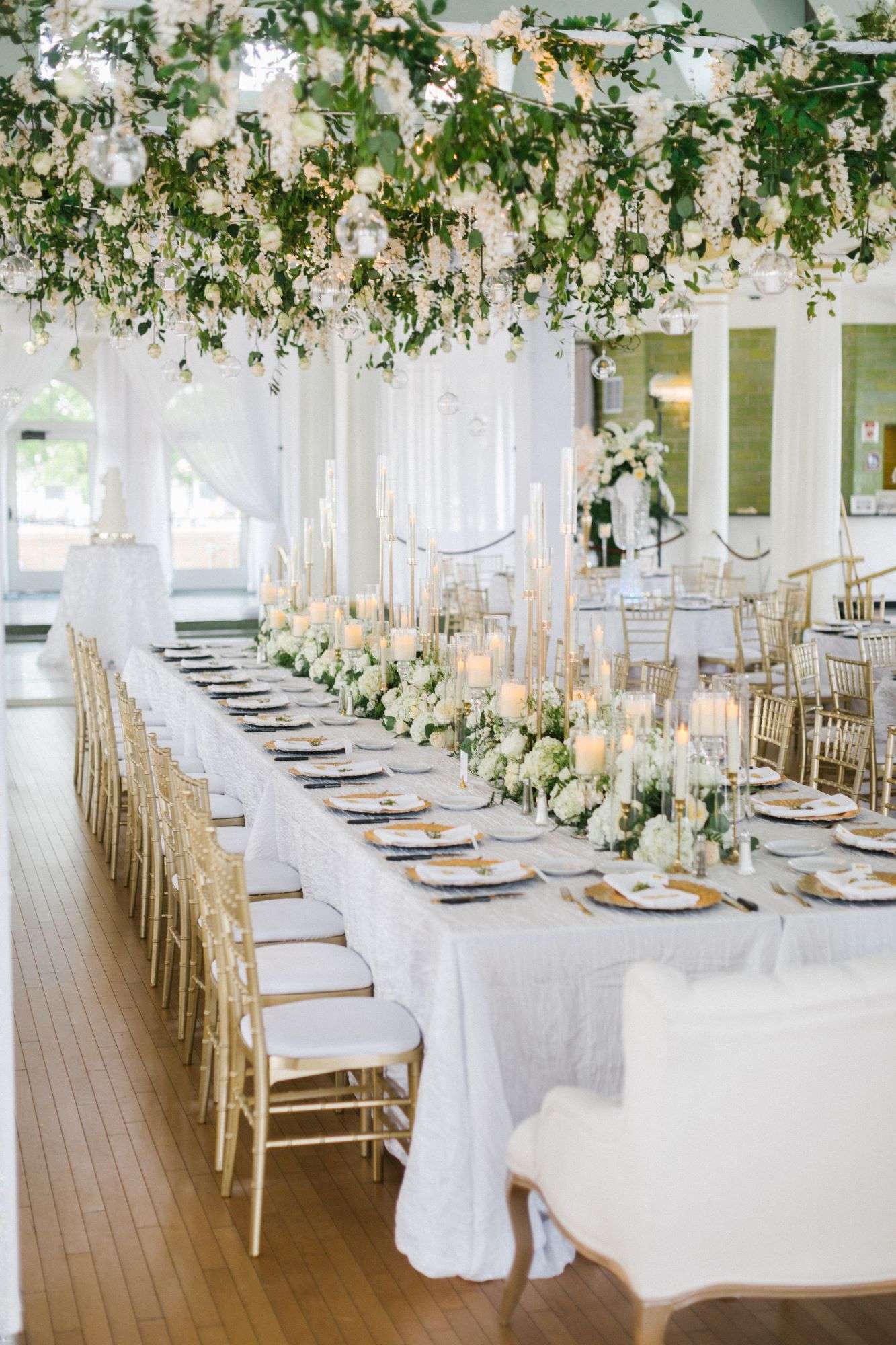 Reflections of You creates floral masterpieces with hanging floral and floral runner on kings table