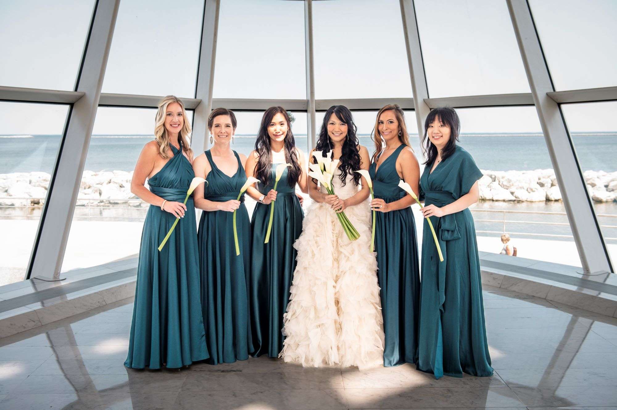 Reflections of You wedding florist providing long stem bridal bouquets with teal bridesmaid dresses