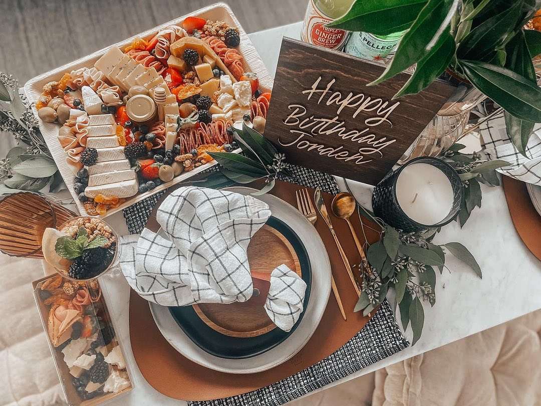 elegant table setting and small charcuterie boards by The Grazing Olive
