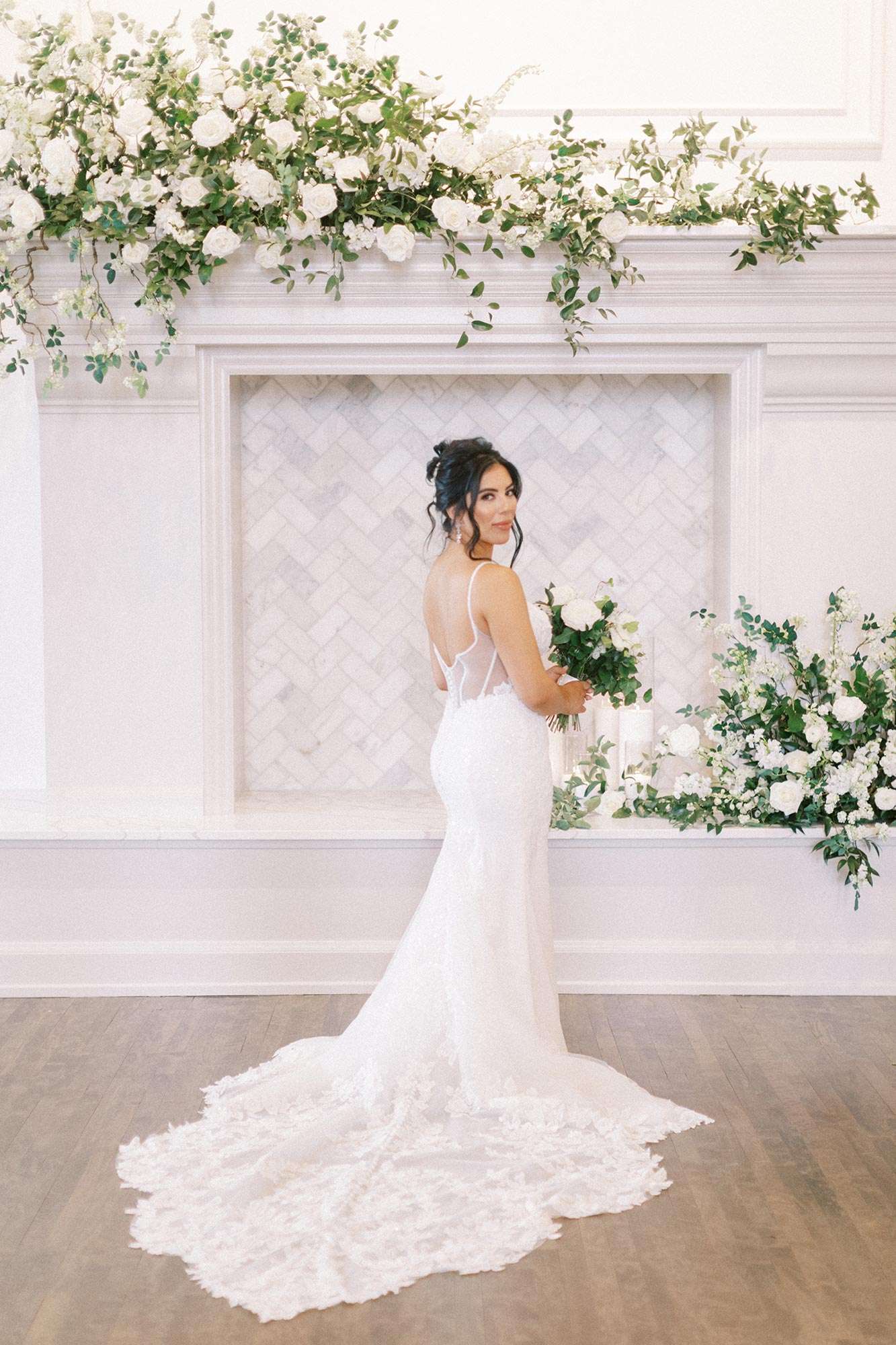 bride's fitted dress with lace train and white sheer back netting by White Dress Bridal Boutique