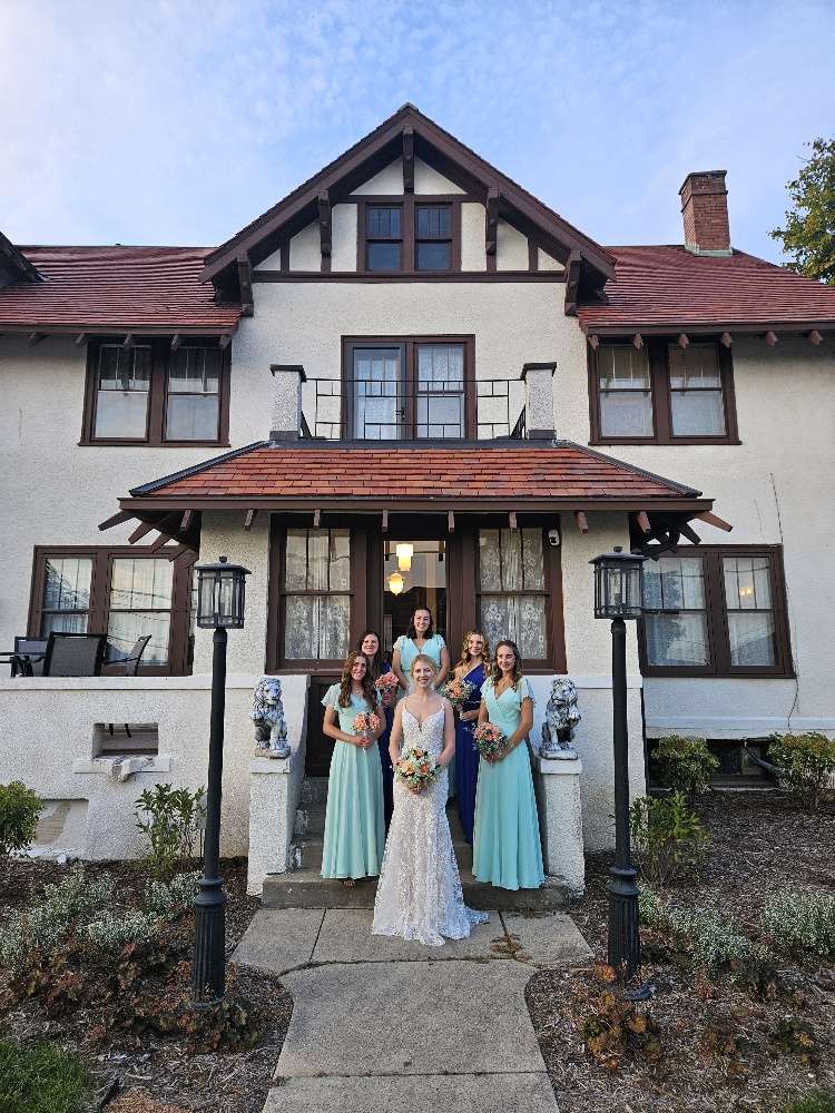 Bridal party standing outside of the Schwartz Family House in Hartford.