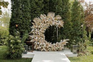 Grand pampas grass wedding ceremony half circle arch.