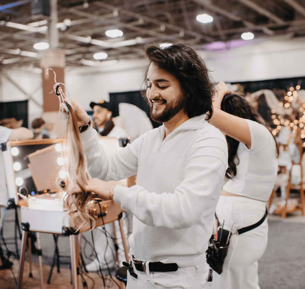 A hair dresser styling extensions and showing products at Wonderful World of Weddings. A hair dresser styling extensions and showing products at Wonderful World of Weddings.