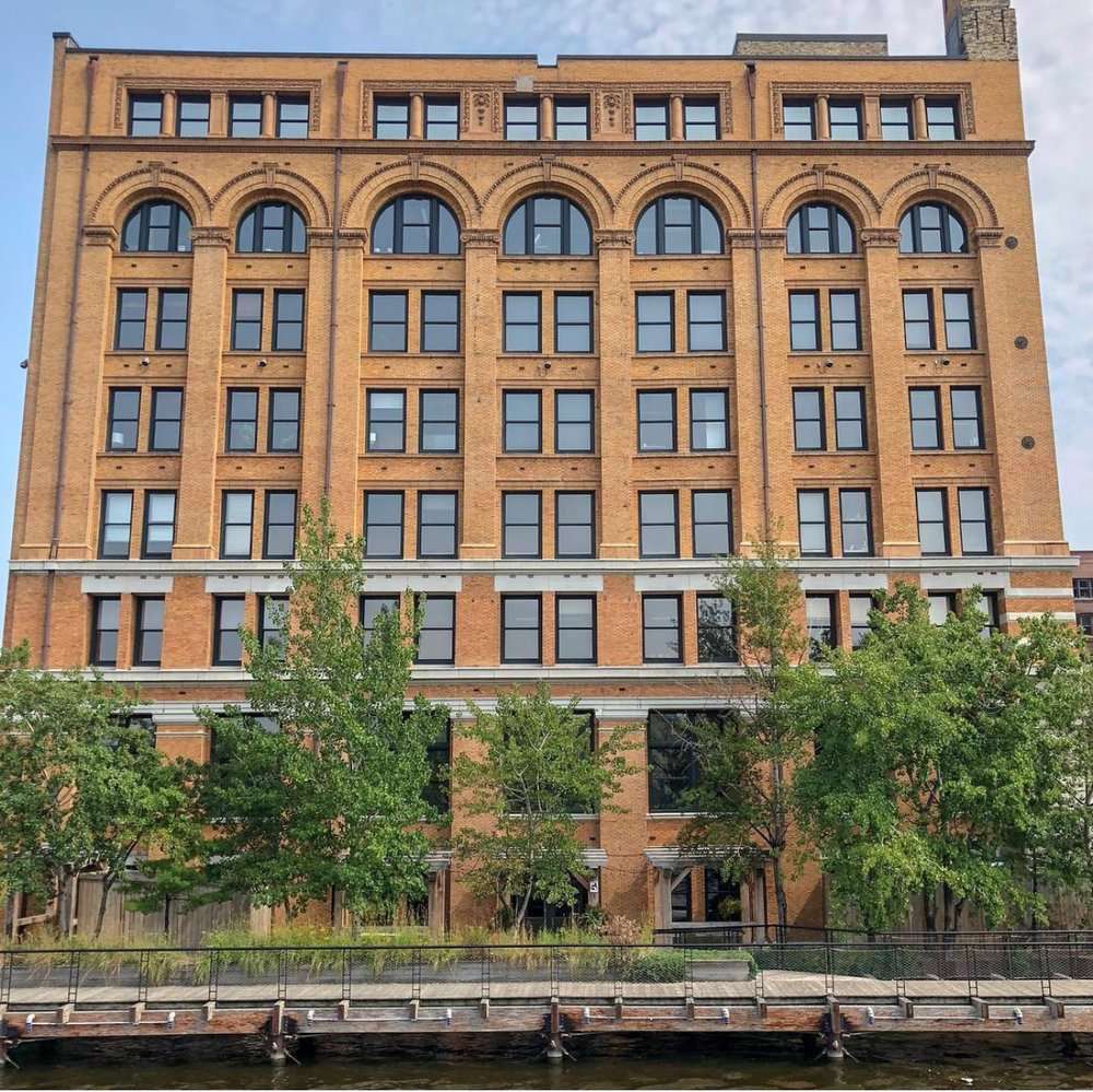 IMG_9253 The Rivulet’s historic Renaissance-style brick building stands tall along the Milwaukee River, blending classic architecture with charm.