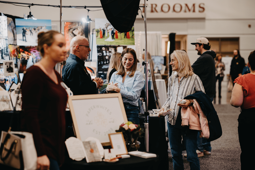 Couples checking out wedding vendors and their booths at Wonderful World of Weddings. Couples checking out wedding vendors and their booths at Wonderful World of Weddings.