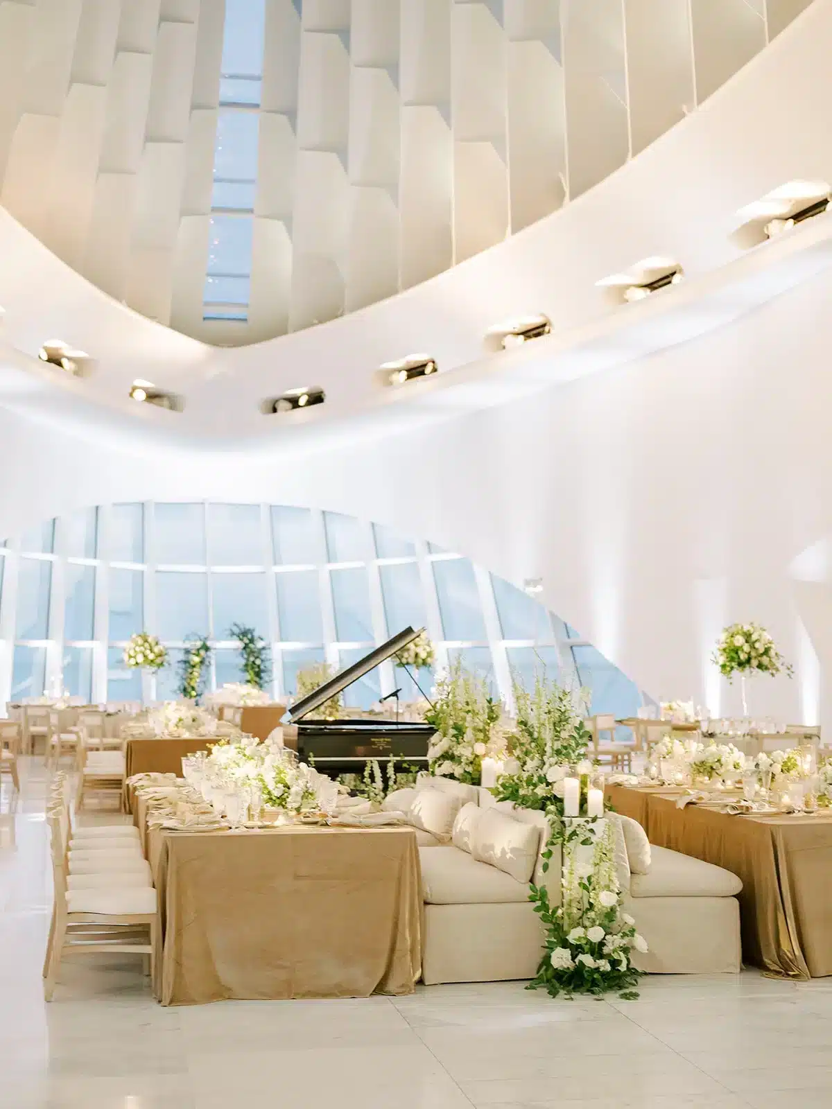 Milwaukee Art Museum setup for wedding with neutral furniture and greenery garlands. Milwaukee Art Museum